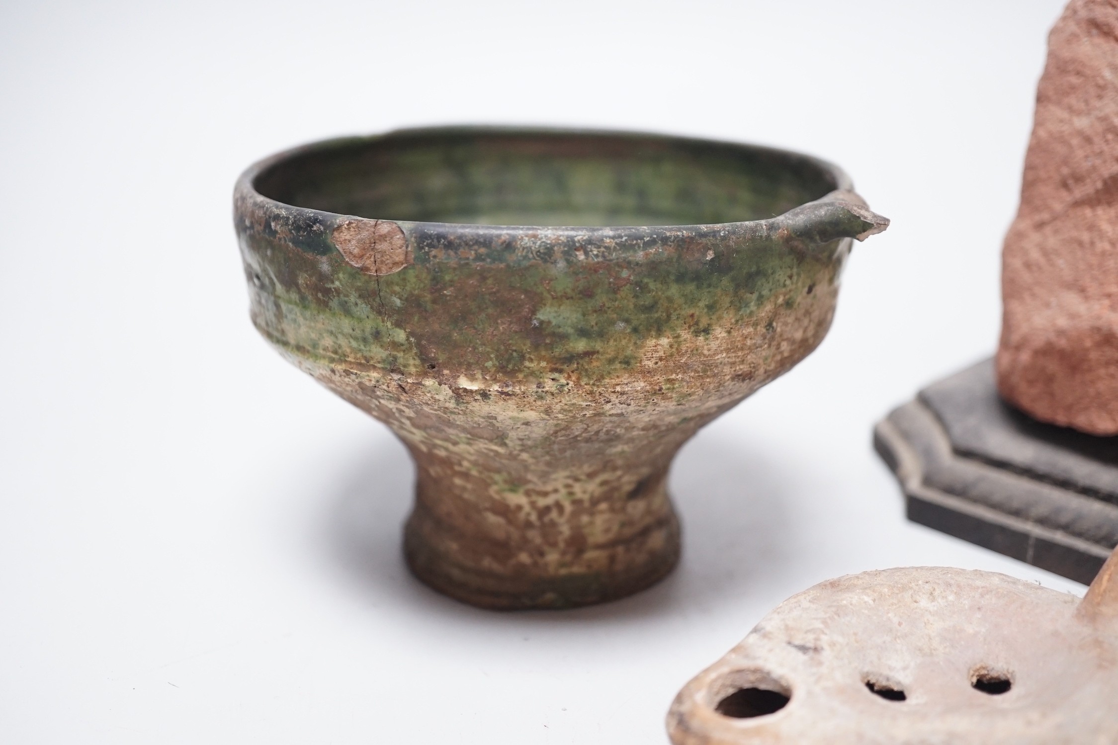 A Roman green glazed vessel, 13 cm wide and a pottery oil lamp, with letter of provenance dated 1942 stating that they were excavated 50-60 years previously during excavations for Lincoln’s Inn New chapel London and a se